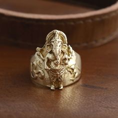 "Ganesh Brass Ring, Ganesha Ring, Golden Ring, Indian Ring, Spiritual Ring, Statement Ring, Hindu Ring, Elephant Ring, Men's Ring, Gift For Him Size:- All Size Available In Variation Metal:- Brass MUST READ....👇 5 stars is my shop's priority. So contact me before leaving any negative review. I am here only for my dear customers. it is poor Etsy manners to Leaving a negative review without conversation with your seller. If you are not satisfied with my jewelry, then please contact me, I will solve your problem. ❥ Customers' satisfaction is our biggest priority, please contact us with any questions/queries for future or existing orders, and we will do our best to make sure you are happy with your order. ❥ Please make sure to add the correct address during checkout. You can return your purch Spiritual Rings As Festival Gifts, Spiritual Rings For Festivals Gift, Spiritual Wedding Rings For Festivals, Unique Rings For Festivals As Gifts, Intricate Design Rings For Festivals Gift, Intricate Design Rings For Festivals And Gifts, Rings With Intricate Design For Festivals, Temple Jewelry Rings For Festivals And Gifts, Festive Rings With Intricate Design As Gift