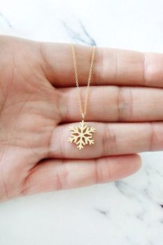 14K 9K Snowflake Charm Necklace, Solid gold necklace, Wintertime Pendant necklace, Winter Jewelry, Dainty Layering Necklace, Winter Jewelry, 9K Snowflake Necklace, FREE EXPRESS SHIPPING Dainty, minimalist necklace with a small snowflake pendant/charm made in 14K or 9K solid gold. We all are like a snowflake...All different in our beautiful way! Whisper...Let it snow! Hammered Disc Necklace: https://www.etsy.com/listing/596508774 -------------------------------------------------- D E T A I L S 14 Delicate Yellow Gold Jewelry For Festive Occasion, Fine Jewelry Snowflake Gift, Snowflake Necklace For Christmas Anniversary, Snowflake Jewelry For Holiday Gifts, White Gold Snowflake Jewelry Gift, Snowflake White Gold Jewelry Gift, Elegant Gold Snowflake Jewelry, Christmas Snowflake Necklace For Anniversary, Holiday Snowflake Jewelry For Gift