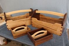 three wooden boxes sitting on top of a table