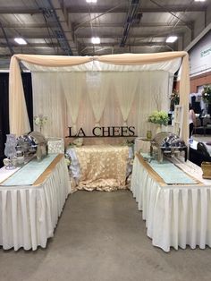 the tables are set up with white linens and gold tablecloths on them