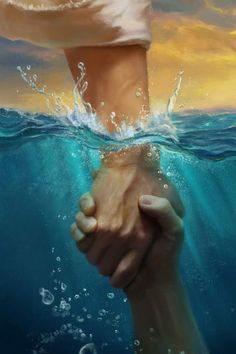 two hands holding each other under water