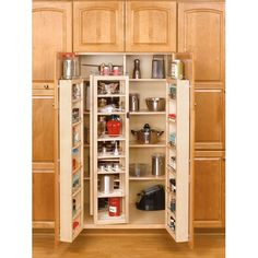 an open cabinet in the middle of a kitchen