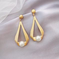 * Buy 2 sets of women’s pearl earrings and receive a free jewelry organizer * Buy more than 2 sets of women’s pearl earrings to receive a $10 discount and a free mirror jewelry organizer Vintage Pearl Earrings Take a look at our beautiful pearl earring design. These pearl drop earrings have been designed by a nature-originated jewelry designer and are made with faux pearls to give you an affordable and vintage style. Made with shell pearls and silver pins, these pearl earrings are easy to care f Mirror Jewelry Organizer, Vintage Pearl Earrings, Handmade Pearl Jewelry, Pearl Earrings Designs, Moonstone Drop Earrings, Real Pearl Earrings, Mirror Jewelry, Opal Drop Earrings, Large Stud Earrings