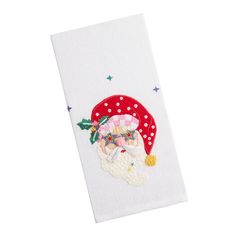 a white towel with a santa clause on it's face and stars in the background