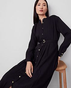 Keep it modern and easy with our pleated midi shirtdress, cinched with a beautifully belted silhouette. Stand collar. Long sleeves with button cuffs. Button front. Front and back knife pleats. Self tie belt. Back yoke. Lined body.,Hit:28" from natural waist,Imported:Imported,Fit:Hits below the knee,Fabrication:100% Polyester,Garment Care:Machine Washable Pleated Belted Midi Shirtdress by Ann Taylor Size regular - 14 Black Women's Shirtdress, Regular, Open, Front, Long, Sleeve, Dresses, 100%, Pol Casual Belted Dress For Fall Workwear, Elegant Button-up Shirt Dress With Pleated Waist, Chic Button-up Dress With Pleated Waist, Elegant Relaxed Fit Shirt Dress With Button Cuffs, Spring Black Belted Dress For Daywear, Black Belted Dress For Spring Daywear, Black Relaxed Fit Shirt Dress For Work, Pleated Button-up Work Dresses, Spring Long Sleeve Shirt Dress With Pleated Waist