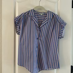 Striped Shirt By Jade. Blue With Red White And Blue Stripes. Tie Front At The Waist And Rolled Cap Sleeves. Size Xs New Without Tags Blue Summer Blouse With Collared Neckline, Blue Collared Blouse For Summer, Blue Short Sleeve Blouse With Button Closure, Blue Collared Neckline Summer Blouse, Blue Blouse With Button Closure And Collared Neckline, Blue Button-up Blouse For Day Out, Chic Blue Shirt With Collared Neckline, Blue Blouse With Button Closure For Day Out, Striped Short Sleeve Blouse For Daywear