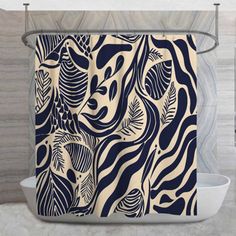 a bathroom with a shower curtain that has an animal print on it and is next to a toilet