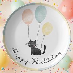 a happy birthday plate with a cat and balloons