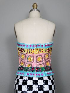 "This is a an absolutely gorgeous vintage embellished strapless top by Julie Duroche - After Five. It's beautifully detailed with multicolored jewels, beads and sequins. It's in excellent condition! Bust - 34\" Waist - 27\" Length - 15\" Tag Size - 10 (fits smaller, please refer to measurements) This item comes from a pet-free and smoke-free home. If you would like more info or have any questions, please don't hesitate to ask!" Strapless Embellished Corset For Party, Strapless Embellished Evening Corset, Summer Party Corset With Sequins, Summer Embellished Corset For Night Out, Summer Embellished Fitted Corset, Embellished Fitted Corset For Summer, Embellished Fitted Summer Corset, Embellished Strapless Corset For Wedding, Glamorous Embellished Fitted Tube Top