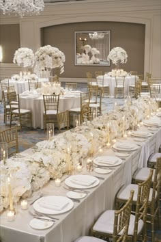 An elegant wedding tablescape featuring beautifully arranged floral centerpieces, classic table settings, and refined details, creating a sophisticated and timeless atmosphere for a memorable wedding reception. All White Wedding Decorations, Timeless Wedding Reception, Gold Reception Decor, Wedding Table Centerpieces Elegant, Gold Wedding Decorations Receptions, Wedding Reception Decor Ideas, Timeless Wedding Decor, Elegant And Timeless Wedding, Reception Decor Ideas