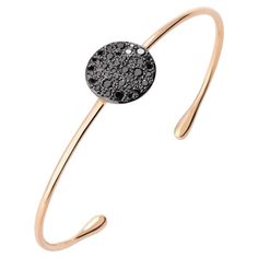 A pave of diamonds conjures images of sand sparking in the sun off the shores of the Mediterranean with this bangle bracelet from Pomellato. This slender bangle will embellish your wrist in all the right ways. Add to your collection today! Style: PBB7010_O7000_DBK00 Features: Pomellato Sabbia 18K Rose Gold Black Diamond Bangle Bracelet, Size Large 18K Rose Gold Burnished Rose Gold Pave and Black Treated Diamonds (0.497 CTS) Slip on style Size: Large Made in Italy Rose Gold Black Diamond, Diamond Bangle Bracelet, Diamond Bangles Bracelet, Diamond Bangle, The Mediterranean, The Conjuring, Bracelet Sizes, 18k Rose Gold, Black Diamond