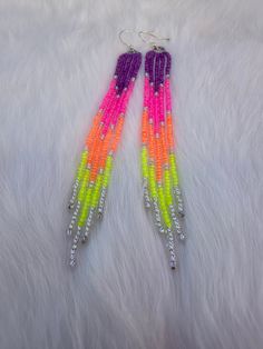 Handmade neon dangle earrings! Handmade Neon Yellow Jewelry For Summer, Neon Yellow Drop Earrings As A Gift, Handmade Neon Jewelry For Summer, Neon Jewelry For Summer Gifts, Vibrant Dangle Beaded Earrings With Colorful Beads, Trendy Dangle Beaded Earrings For Festivals, Trendy Beaded Dangle Earrings For Festival, Vibrant Dangle Earrings With Colorful Beads, Trendy Beaded Festival Earrings