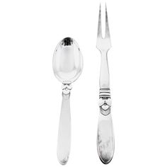 a fork, spoon and knife on a white background