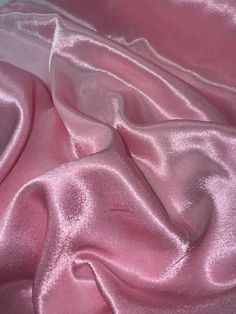 Baby pink crepe back satin This high-quality satin fabric is a perfect choice for any project that requires a touch of elegance and sophistication. The 58-inch width make it suitable for a wide range of applications, from apparel to home decor and crafts. The fabric comes in a beautiful shade of silver, which adds a classy and luxurious feel to any design. Ideal for use in bridal dresses, blazers, curtains, and even marquees, this shiny crepe back satin fabric offers excellent drape and durability. Whether you are a professional designer or a DIY enthusiast, this fabric is sure to inspire your creativity and help you create stunning and unique creations. Get your hands on this gorgeous fabric today and let your imagination run wild! Delivery All items are dispatched within 1-2 working days Deco Dress, Baby Rosa, Gorgeous Fabrics, Satin Fabric, Baby Pink, Bridal Dresses, Satin, Purses And Bags, Music Clothes