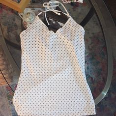 Ivory W/Golden Bronze Metallic Polka Dots. Size Medium. Their Classic Cami/Tank Tops With Built In Shelf Bras For Support. This One Is Halter Style Of Which Just A Few Colors Were Made. Brand New. From Express. White Halter Neck Camisole With Built-in Bra, White Halter Top With Built-in Bra For Spring, Chic Cotton V-neck Halter Top, Fitted Cotton Halter Top With Built-in Bra, Cotton Sleeveless Halter Top With Built-in Bra, White Tank Top With Built-in Bra For Day Out, Trendy White Halter Camisole Top, Sleeveless Tank Top With Built-in Bra For Brunch, Fitted V-neck Camisole For Brunch