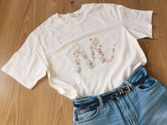 White T-shirt With Letter Embroidery As Gift, White T-shirt With Letter Embroidery For Gift, Summer Everyday T-shirt With Embroidered Text, Casual T-shirt With Floral Embroidery For Gift, Cotton T-shirt With Letter Embroidery As Gift, Cotton T-shirt With Letter Embroidery For Gift, Spring Crew Neck T-shirt With Butterfly Embroidery, Summer Short Sleeve T-shirt With Letter Embroidery, Cute Embroidered T-shirt For Spring