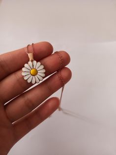 Color: silver , gold Chain: .45 cm Pendant size: 1.8cm / 1.8cm Material: 925 Sterling Silver 925 sterling small daisy necklace will look very elegant on your neck. We can open it and write any name, word or word you want into it. 925 sterling tiny daisy pendant provides a very elegant and nice look on your neck It will enchant you with its elegance. It provides very comfortable use in your daily life. It can be a great gift to your loved ones. birthdays, anniversaries, Valentine's day or even Ch Everyday Flower Charm Necklaces, Everyday Flower Pendant Necklace, Cute Flower Pendant Jewelry For Gifts, Cute Flower Pendant Jewelry Gift, White Flower Shaped Necklace With Adjustable Chain, White Flower Pendant Necklace As Gift For Mom, Sterling Silver Daisy Jewelry, White Dainty Flower Pendant Necklace, Dainty White Flower Pendant Necklace