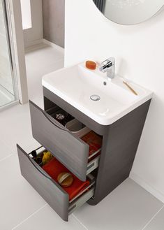 a bathroom sink with drawers underneath it