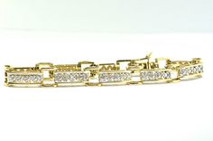 14k Yellow Gold And Diamond Bracelet Bracelet/ Bangle Type of Gold yellow gold Metal Purity 14k Weight of Gold 12.7 Grams Total Carat Weight 0.50CT Stones Diamonds We are a small family owned business located in Massapequa, N.Y. Customer satisfaction is our number one goal, and we will do everything we can to ensure that you are very happy with your purchase! IF YOU HAVE ANY QUESTIONS, YOU CAN CALL US AT (516)308-3590 OR EMAIL US AT LANASJEWELRY2@YAHOO.COM AND WE WILL DO OUR BEST TO ANSWER YOU A Yellow Gold Diamond Bracelet With Solid Link For Anniversary, Hallmarked Yellow Gold Diamond Bracelet For Anniversary, Anniversary Yellow Gold Hallmarked Diamond Bracelet, Round Gold Bracelet With Solid Link Construction For Anniversary, Round Gold Bracelet With Solid Link For Anniversary, Round Gold Anniversary Bracelet With Solid Link, Anniversary Gold Bracelet With Solid Link, Formal 14k Gold Hallmarked Diamond Bracelet, 14k Gold Hallmarked Diamond Bracelet For Anniversary