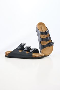 Ready to rock some sandals? Slip into the MAIBULUN Deidra Tri-Strap Footbed Sandal and take your summer style to the next level! These sandals are comfortable, stylish and sure to add a little extra sass to any outfit -- you won't be able to resist showing them off! So buckle up, and let those feet shine! Slip-on / buckle closure Hard Cushioned footbed Man-made leather upper Man-made lining EVA sole Black Slip-on Sandals With Adjustable Strap, Strappy Leather Footbed Sandals For Vacation, Black Flat Slides With Cork-bed Midsoles, Strappy Beach Footbed Sandals With Cork-bed Midsoles, Strappy Footbed Sandals With Cork-bed Midsoles For Beach, Beach Strappy Sandals With Cork-bed Midsoles, Strappy Beach Sandals With Cork-bed Midsoles, Black Slides With Adjustable Strap For Vacation, Black Summer Footbed Sandals With Cork-bed Midsoles