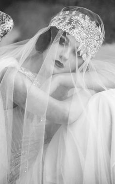 black and white photograph of a woman wearing a veil