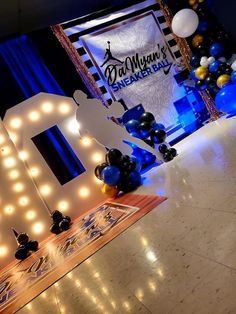 balloons and lights decorate the entrance to an event