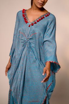 Sky blue printed kurta with front knot paired and has handmade tassels, metal detailing on the neckline. Paired with straight palazzo pant. - Aza Fashions Blue Bohemian Tunic Set, Blue Silk V-neck Kaftan, Summer Silk V-neck Kurta, Blue Tunic Sets For Spring, Blue V-neck Kurta With Printed Motifs, Blue V-neck Sets For Vacation, Elegant Blue Vacation Sets, Blue Printed Kurta For Spring, Blue Silk Kurta For Summer