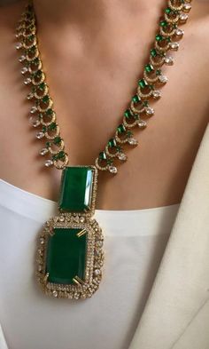 Inspired by the timeless elegance of Sabyasachi Mukherjee's designs, this exquisite Victorian long necklace set with earrings encapsulates opulence and tradition in every detail. Crafted in a rich shade of emerald green, the doublet necklace features intricate embellishments that evoke the grandeur of Victorian-era jewelry.  The necklace itself is a masterpiece of craftsmanship, adorned with delicate filigree work, sparkling crystals, and meticulously placed pearls. Each element is carefully cho