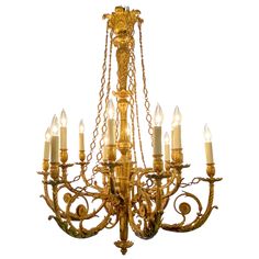 an antique chandelier with many lit candles