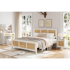 a bedroom with white walls and wood floors, including a bed frame made from wicker