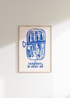 a blue and white print hanging on the wall