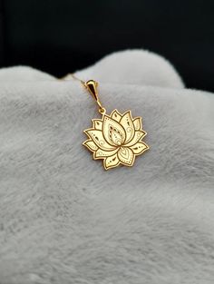 Introducing our exquisite Lotus Flower Shaped Necklace, a symbol of purity and enlightenment beautifully crafted in 14K gold. This delicate piece features a floral engraved design that adds a touch of elegance and serenity, perfect for those who cherish the art of yoga and meditation. Its dainty and minimalist style makes it an ideal everyday accessory or a thoughtful gift for the special women in your life. ⚜️ Package included: One Handmade Necklace ⚜️ Pendant Sizes: 14 / 16 / 18 / 20 / 22 / 24 Spiritual Gold-plated Necklaces With Intricate Design, Spiritual Gold Plated Necklaces With Intricate Design, Spiritual Gold Plated Necklace With Intricate Design, Gold Spiritual Necklace With Birth Flower, Spiritual Filigree Flower Pendant Necklace, Spiritual 14k Gold Jewelry For Gifts, Spiritual Rose Gold Jewelry For Meditation, Spiritual Engraved Jewelry For Her, Elegant Gold Plated Jewelry For Meditation