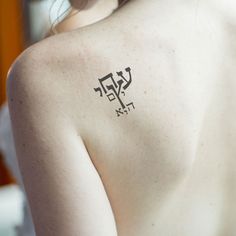 a woman with a tattoo on her back