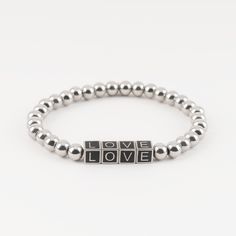 Take your wrist game up a notch with our "Love" Beaded Friendship Bracelet! This silver beaded bracelet features letters spelling out the word 'LOVE.' Squad goals? Friendship bracelets are the ultimate bestie accessory! Simply add this friendship bracelet to your collection and let your wrist do the talking! Silver Heart Beads Bracelets For Friendship, Sterling Silver Friendship Bracelets For Valentine's Day, Silver Heart-shaped Friendship Beaded Bracelets, Valentine's Day Silver Friendship Bracelets, Heart-shaped Silver Friendship Bracelets As Gift, Silver Friendship Bracelets, Beaded Hearts, Silver Beaded Bracelet, Bracelets Beaded