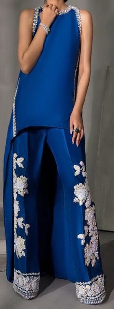 Product Description:  Shirt with embellisment Color: Blue Includes:  Shirt, Pants. Fabric Detail:  Shirt: Raw silk Pants: Raw silk Elegant Blue Embroidered Sharara, Fitted Blue Embroidered Pant Set, Elegant Blue Pant Set For Festive Occasions, Elegant Festive Blue Pant Set, Fitted Blue Pant Set With Resham Embroidery, Festive Embroidered Blue Bottoms, Elegant Fitted Blue Pant Set, Elegant Blue Pant Set With Resham Embroidery, Elegant Blue Palazzo Set For Party