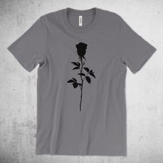 **Please note, Shirts orders are taking about two weeks to ship** Read the statement in the shop's FAQ for further information or learn more at the bottom of this product description. Black Rose | Rose Silhouette - Premium Cotton Tee This updated essential unisex jersey t shirt fits like a well-loved favorite, featuring a crew neck, short sleeves and designed with superior Airlume combed and ring-spun cotton that acts as the best blank canvas for printing. Features: Side-seamed. Retail fit. Unis Rose Silhouette, Rose Shirts, Rose T Shirt, Shirt Fits, Jersey Design, Blank Canvas, Black Rose, Jersey T Shirt, Shoulder Taping