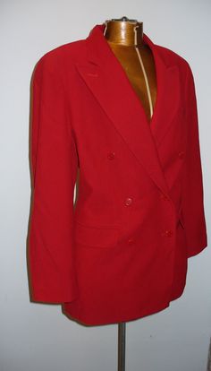 This jacket is in wonderful condition with exception of one moth hole on the sleeve near the buttons. It has been priced accordingly.Boxy construction, wide lapel double breasted 97% wool. A real power piece. Measures Chest at underarm 42" Sleeve Length 23" Length form bottom neck 28.5" .Please measure carefully and feel free to ask more questions regarding size and condition as there are no refunds or exchanges. Lot BR r-3 Vintage Blazers, Pin Up Shoes, Wool Cape, Lipstick Red, Leather Trench Coat, Vintage Blazer, Coat Fashion, Wool Jacket, Vintage Black