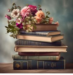 a stack of books with flowers on top