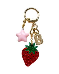 You're seen our viral bag charms content all over social media -- and ELLE, Who What Wear & the Wall Street Journal twice.We're excited to introduce this limited-edition STRAWBERRY GIRL KEYCHAIN that is so darling that you will want to attach to all of your precious belongings. Featuring a cutesy strawberry charm and a bubbly pink star charm. Your choice to add a Blingy Bauble initial to level up! So perfect as a personalized gift. Find the other charm options here. A few ideas on how to style t Xmas Gift For Friends, Cool Girl Gifts, Key Chain Charms, Trendy Accessories 2024, Cute Car Keys Keychains Ideas, Bag Keychain Aesthetic, Key Chains Aesthetic, Car Keys Keychain Ideas, Cute Keychains For Car Keys