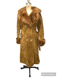 In excellent vintage condition. Some stitching loose on right pocket. Minor signs of wear.  Measurements laying flat  18" pit to pit  46" length Vintage Brown Fur Coat With Pockets, Ranch Cowgirl, Belted Coat, Vintage 70s, Abercrombie Fitch, Double Breasted, Coats Jackets, Stitching, Jackets & Coats