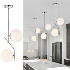 an image of a kitchen with lights hanging from the ceiling and on the counter top