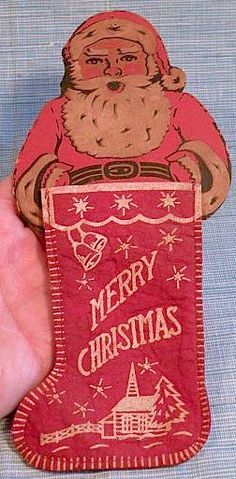 an old fashioned christmas stocking with santa claus on it's back and the words merry christmas