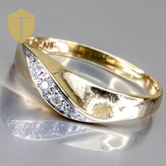 This vintage 10K yellow gold band is a charming and delicate piece, weighing 1.9 grams and sized at 9. It features four sparkling diamonds with a total weight of approximately 0.04 carats, adding a subtle touch of brilliance to the classic gold band. With a finger coverage of around 5mm and a rise of 3.9mm, this ring has a slender yet elegant profile. In great condition, it perfectly balances vintage style with timeless appeal, making it a lovely choice for those who appreciate understated beauty. Karat: 10k Weight: 1.9 g Size: 9 Approximate measurement: coverage: 5 / Rise : 3.9 Stone(Approx. Size): Diamond 4(0.04cttw) Markings: 10k Condition: Great Approx. Era: Vintage DELIVERY: Our shipping and handling is always fast & free unless otherwise stated. Once an order is placed and payment is Ladies Ring, Classic Gold, Vintage Ring, Sparkle Diamonds, Gold Band, Vintage Stil, Rings Statement, Gold Bands, Women Rings