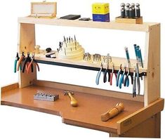 a wooden shelf with various tools on it