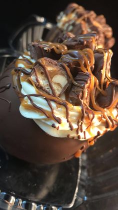 chocolate covered dessert sitting on top of a glass plate