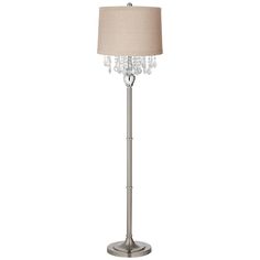 a floor lamp with a beige shade on the base and crystal beads hanging from it