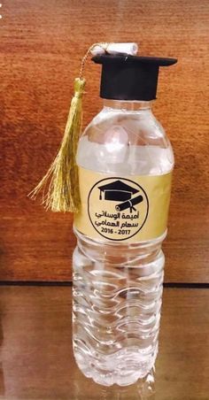 a water bottle with a graduation cap on it