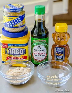 the ingredients to make peanut butter cookies are displayed on a counter top, including honey and sugar