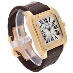 Cartier Santos 100 XL 18K Yellow Gold Brown Strap Mens Watch W20071Y1. Automatic self-winding movement caliber 049. 18K yellow gold 38 x 51 mm. Protected octagonal crown set with the faceted spinel. High polished 18K yellow gold bezel punctuated with 8 signature screws. Scratch resistant sapphire crystal. Silvered opaline dial with painted radial roman numerals. Inner minute track. Luminous sword shaped hands. Secret Cartier signature at VII. Brown leather strap with brushed and polished 18K yel Yellow Gold Watches With Chronometer And Rectangular Dial, Designer Yellow Gold Watch With Subdials, Cartier Yellow Gold Chronometer Watch Accessories, Yellow Gold Watches With Subdials For Anniversary, Cartier Chronometer Watch Accessories In Yellow Gold, Yellow Gold Watch Accessories With Subdials, Anniversary Yellow Gold Watches With Subdials, Luxury Gold Cartier Watch, Designer Yellow Gold Chronometer Watch