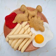 a wooden plate topped with different types of food